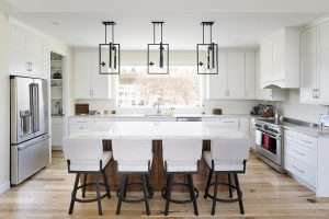 open-concept kitchen with a large granite island